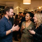 Man talking to women at a party